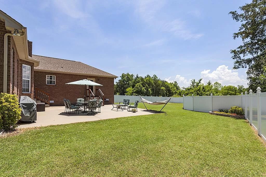 827 Oslo Road Mount Juliet, TN 37122 - Photo 23 of 25 a view of swimming pool with outdoor seating and house in the background