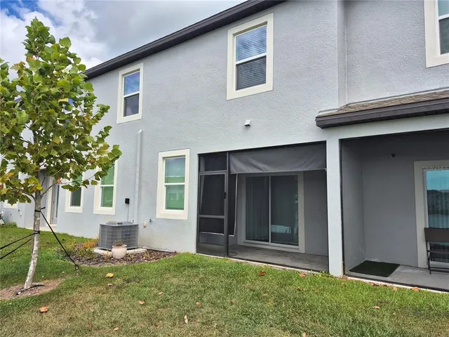 a view of house with yard