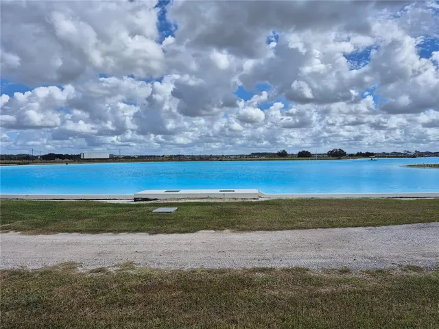 a view of a swimming pool with a yard