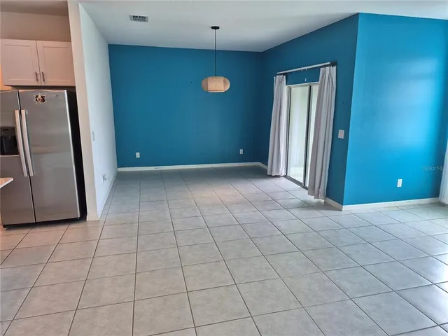 a view of a livingroom with an empty space and a sink