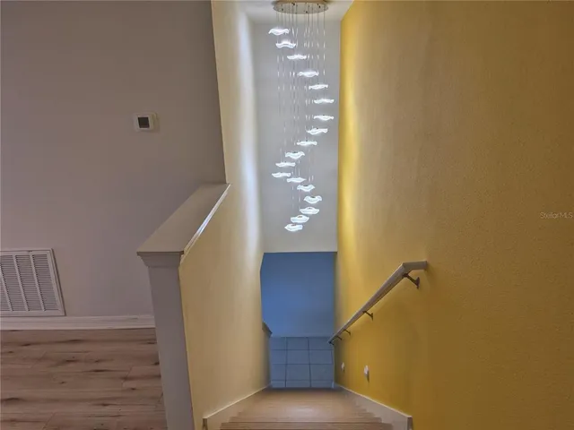 a view of a hallway with staircase