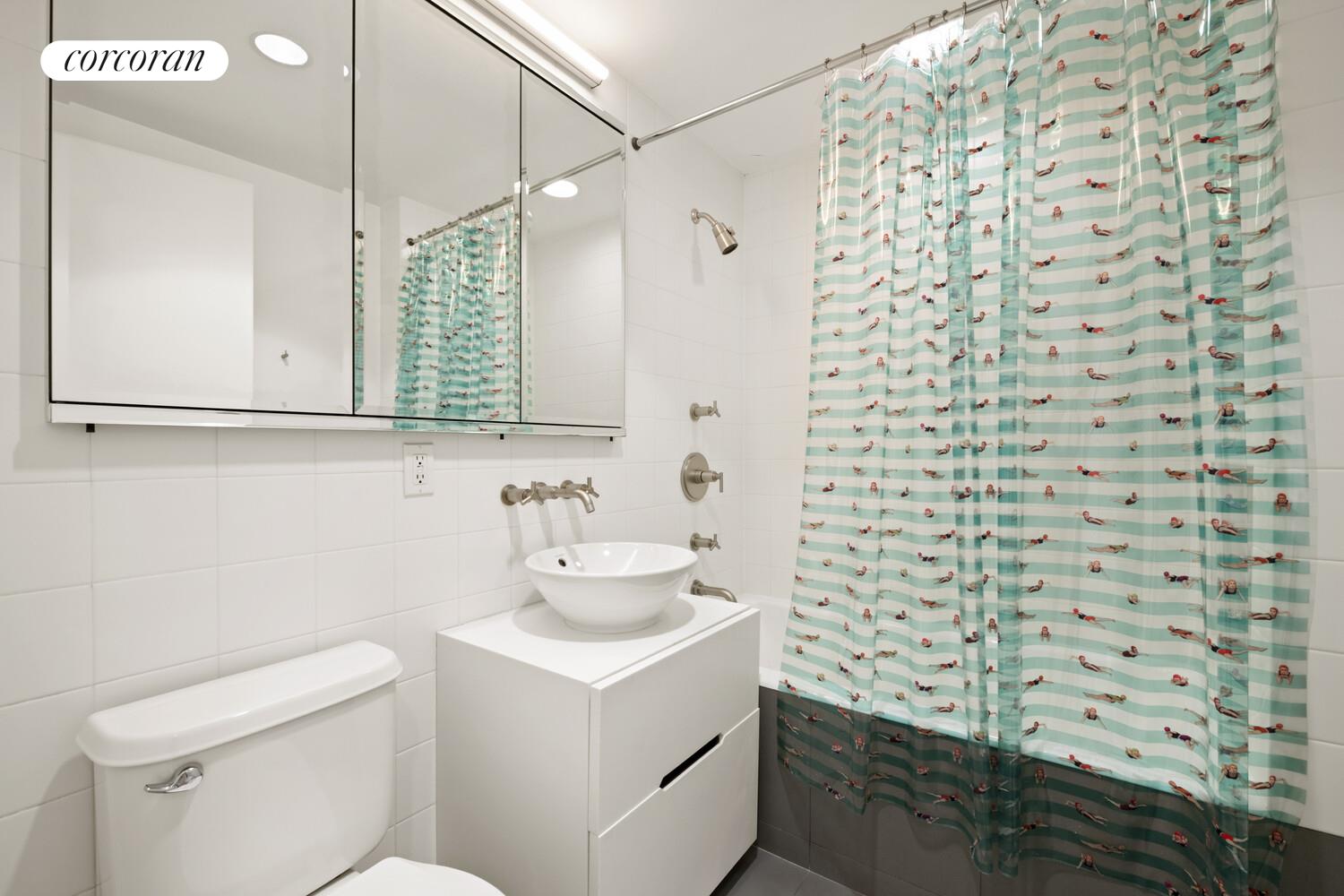 56 West 71st Street, Unit 2A Manhattan, NY 10023 - Photo 10 of 17 a bathroom with a sink and a mirror