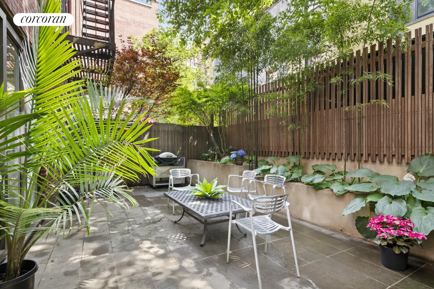 56 West 71st Street, Unit 2A Manhattan, NY 10023 - Photo 13 of 17 a view of a chairs and table in a backyard