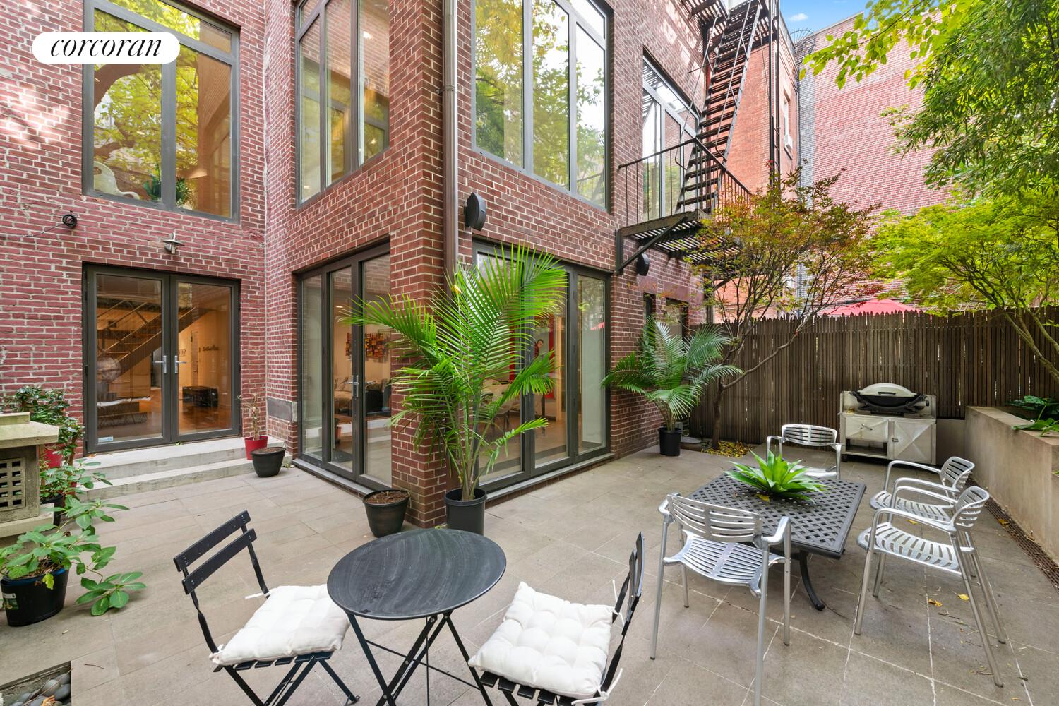 56 West 71st Street, Unit 2A Manhattan, NY 10023 - Photo 3 of 17 a view of a patio with couple of chairs and a potted plant