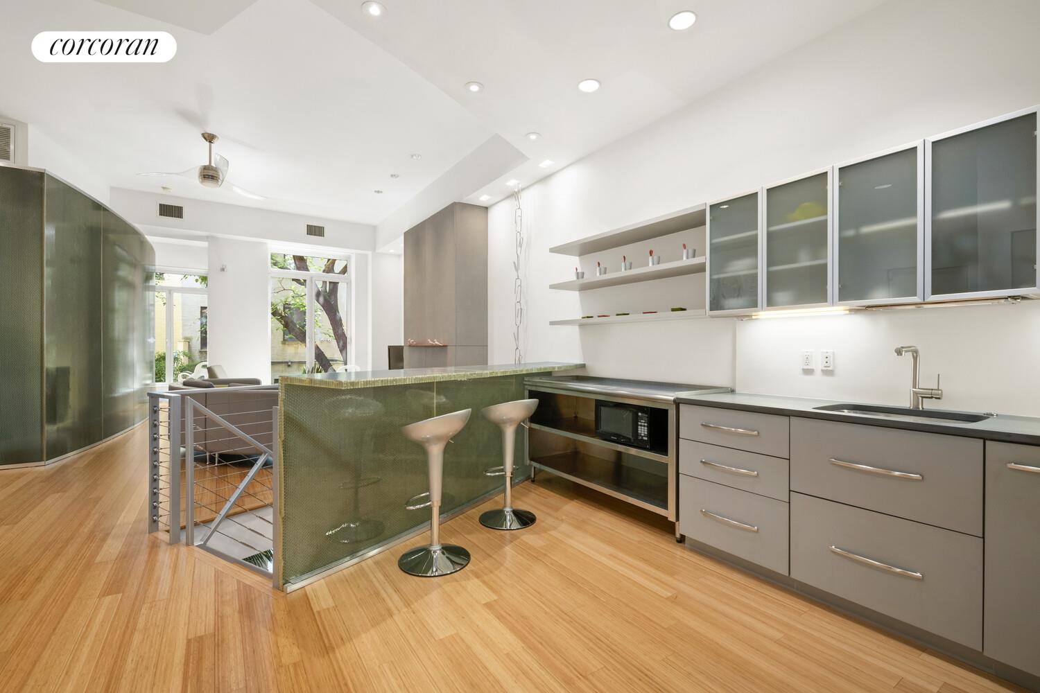 56 West 71st Street, Unit 2A Manhattan, NY 10023 - Photo 5 of 17 a kitchen with stainless steel appliances granite countertop a stove and a sink