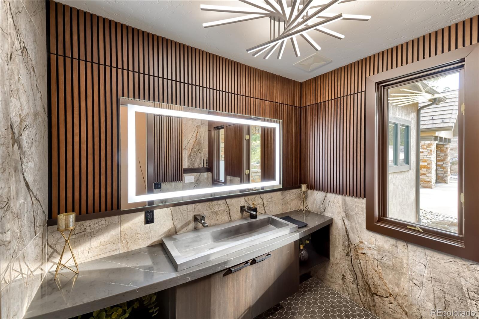 730 Genesee Mountain Road Golden, CO 80401 - Photo 7 of 50 a bathroom with a sink and a large mirror