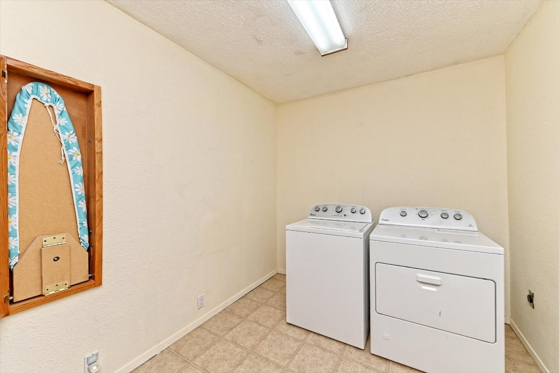 5205 Brookdale Lane Austin, TX 78723 - Photo 18 of 22 a utility room with dryer and washer