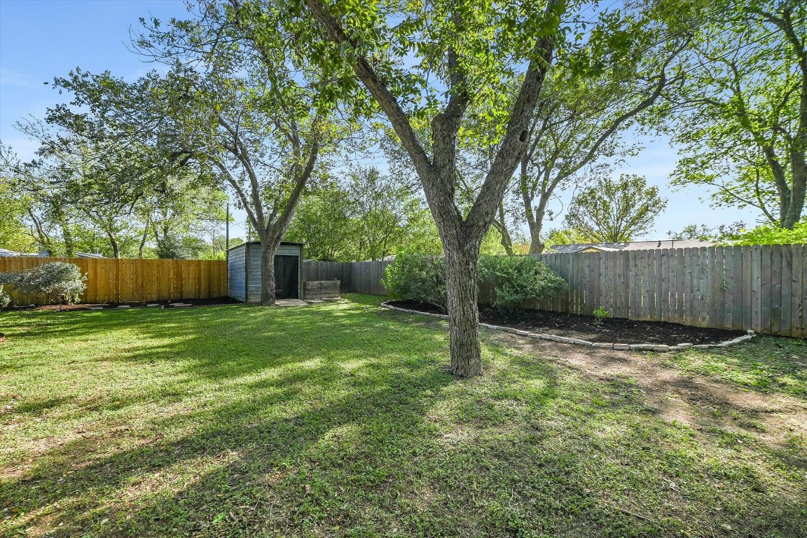 5205 Brookdale Lane Austin, TX 78723 - Photo 22 of 22 a view of a backyard with a trees