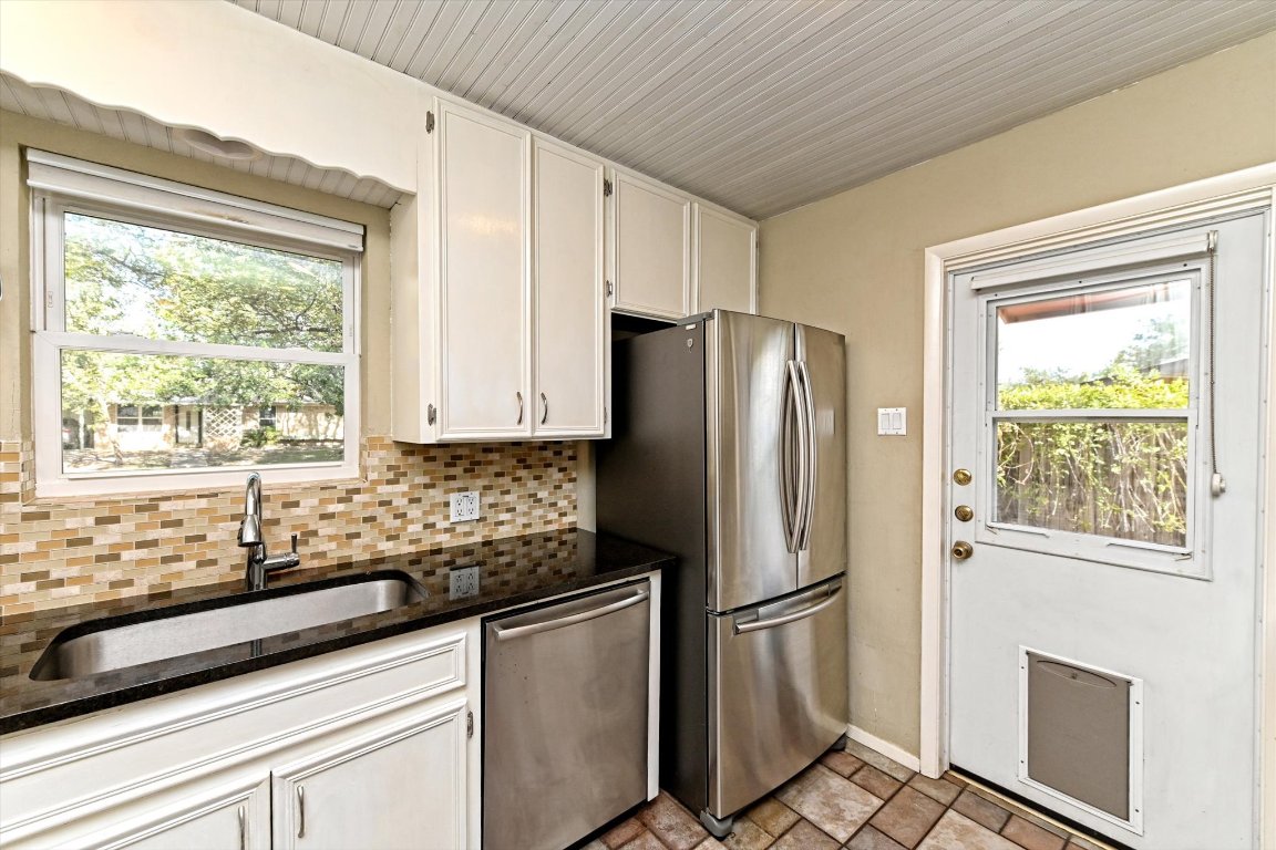 5205 Brookdale Lane Austin, TX 78723 - Photo 8 of 22 a kitchen with stainless steel appliances a refrigerator sink and cabinets