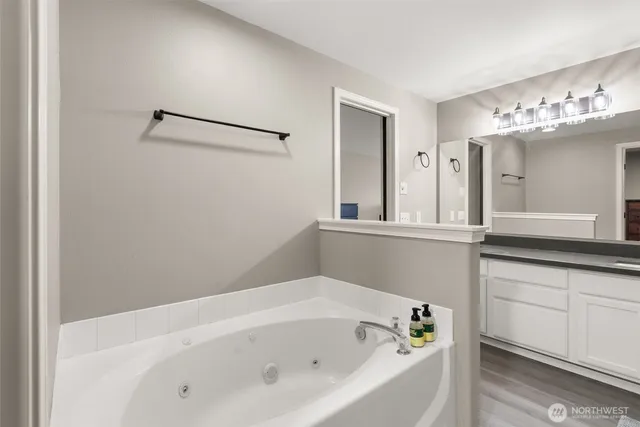 a bathroom with a bathtub and a sink