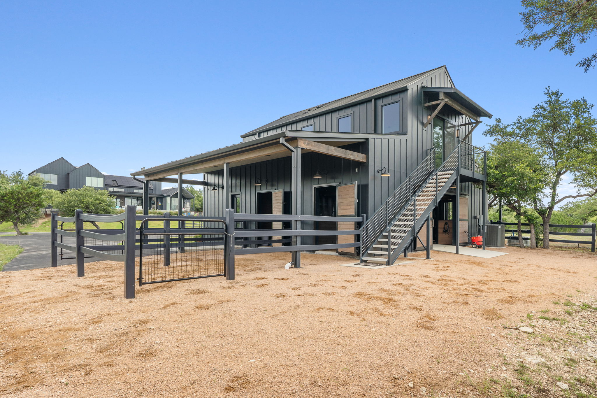 475 Happy Trail Dripping Springs, TX 78620 - Photo 39 of 40 Access the barn apartment via private stairs at the back of the barn.