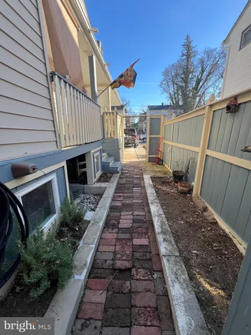 a view of a backyard with sitting area