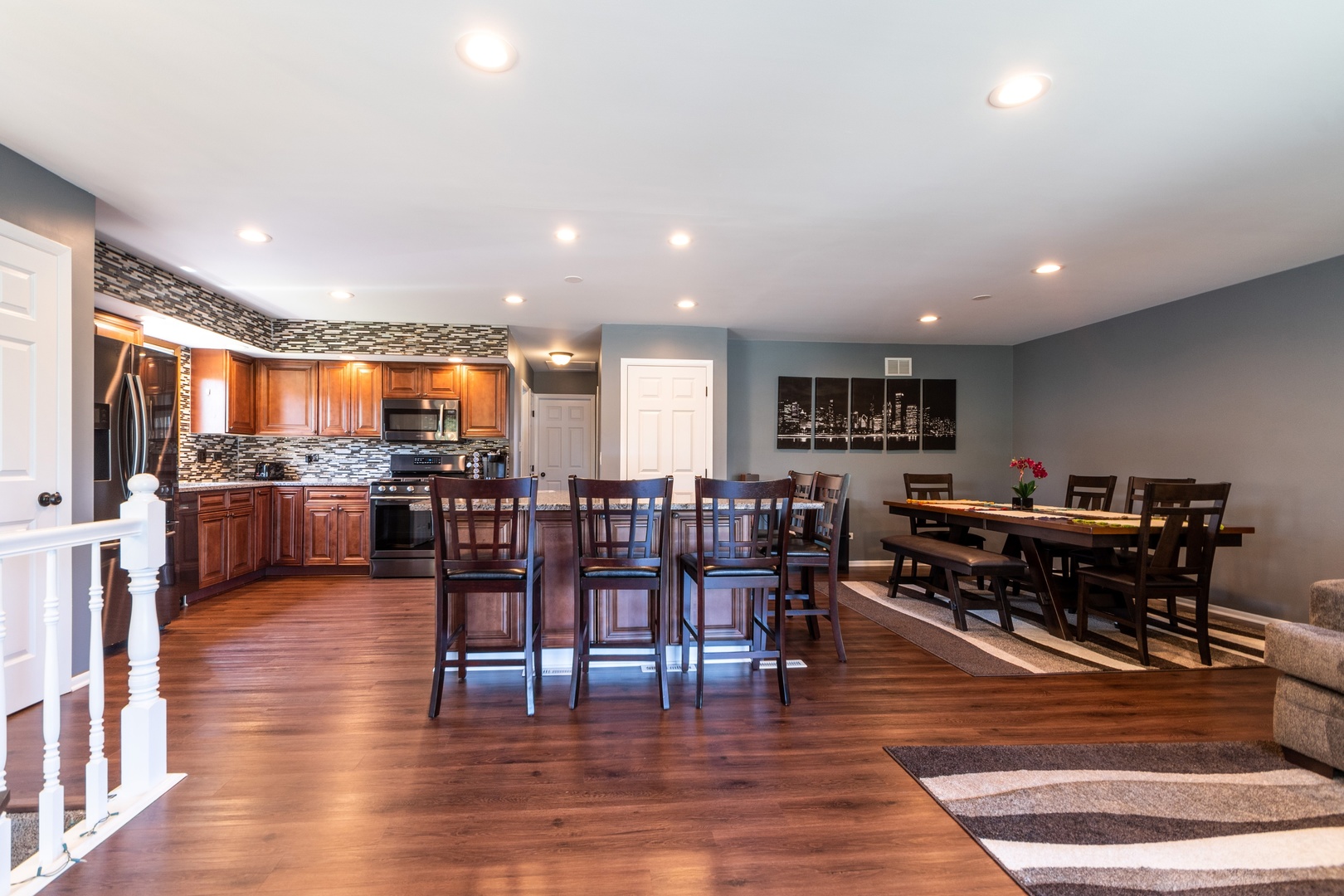 16046 Eagle Ridge Drive Tinley Park, IL 60477 - Photo 3 of 14 a living room with lots of furniture and kitchen view