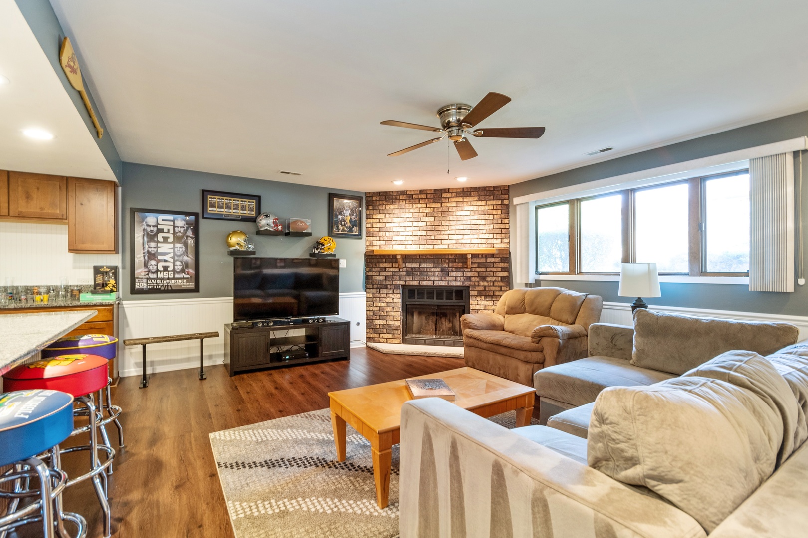 16046 Eagle Ridge Drive Tinley Park, IL 60477 - Photo 6 of 14 a living room with furniture a flat screen tv and a fireplace