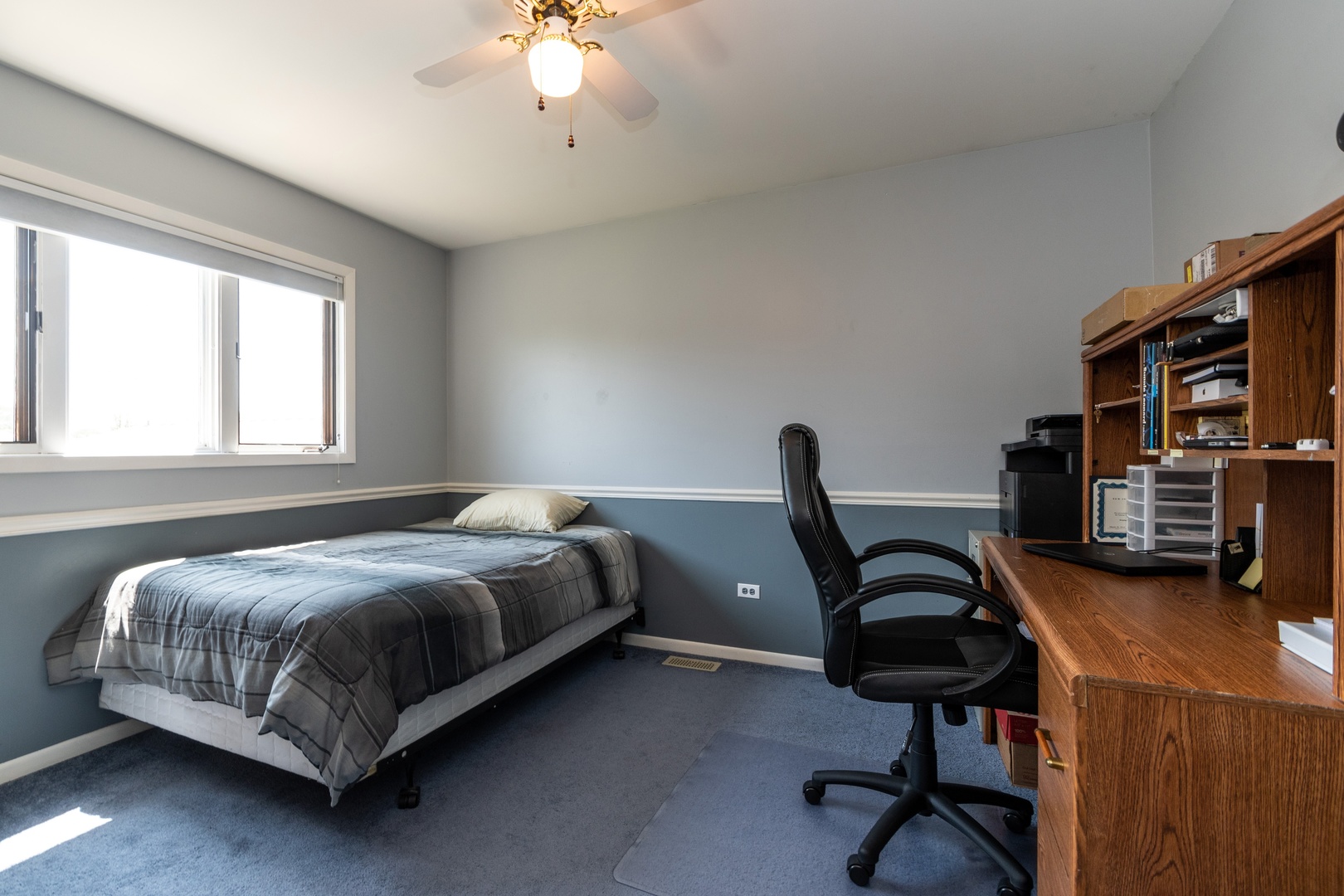 16046 Eagle Ridge Drive Tinley Park, IL 60477 - Photo 9 of 14 a bedroom with a bed a desk and chair with windows