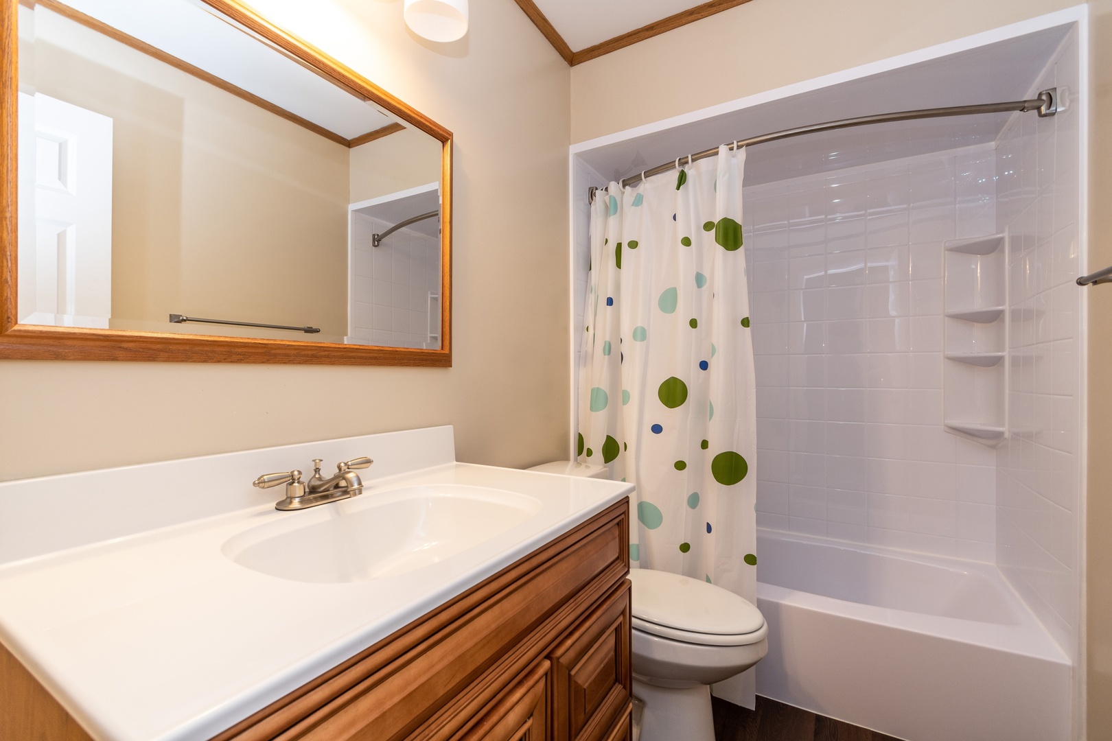 16046 Eagle Ridge Drive Tinley Park, IL 60477 - Photo 10 of 14 a bathroom with a sink toilet and shower