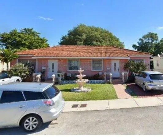 a view of a house with swimming pool and a yard