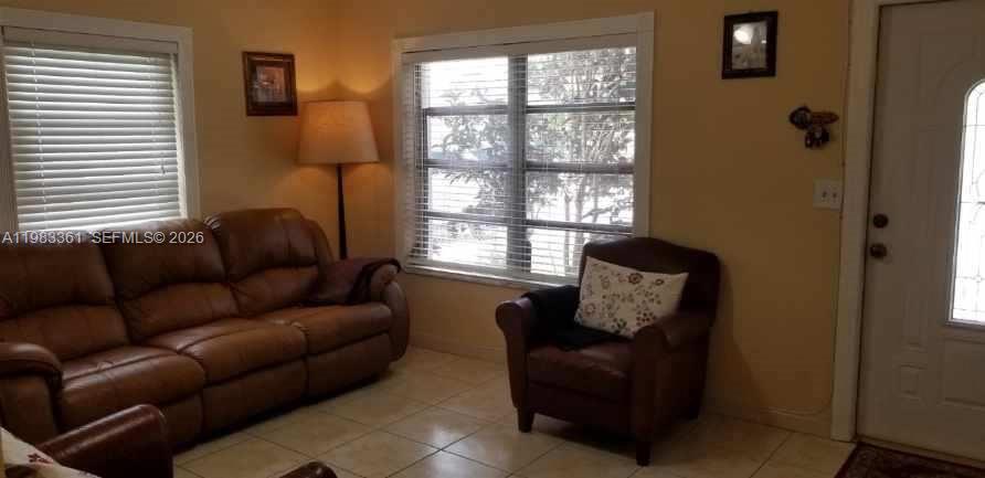 2787 Southwest 34th Court Miami, FL 33133 - Photo 5 of 15 a living room with furniture and a window