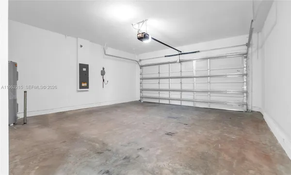 an empty room with closet and windows