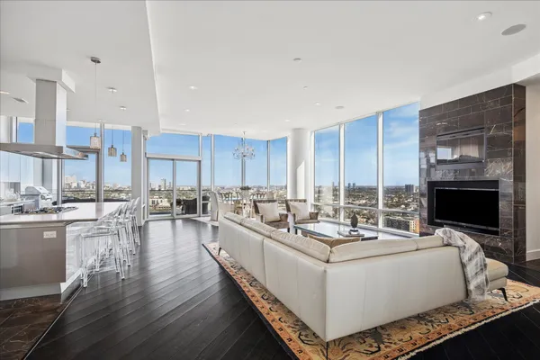 a living room with fireplace furniture and a flat screen tv