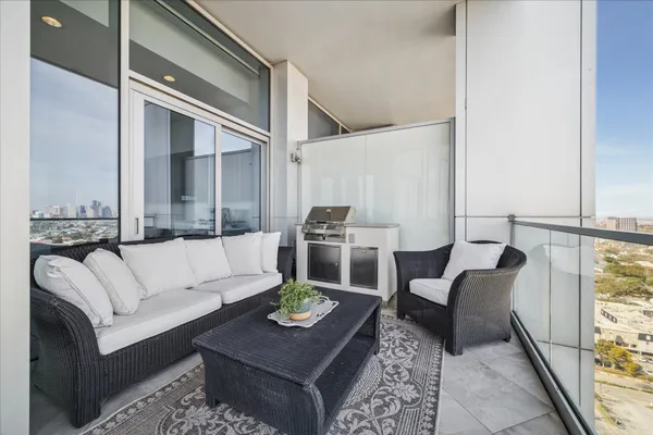 a living room with furniture and a rug