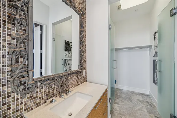 a bathroom with a sink and a mirror