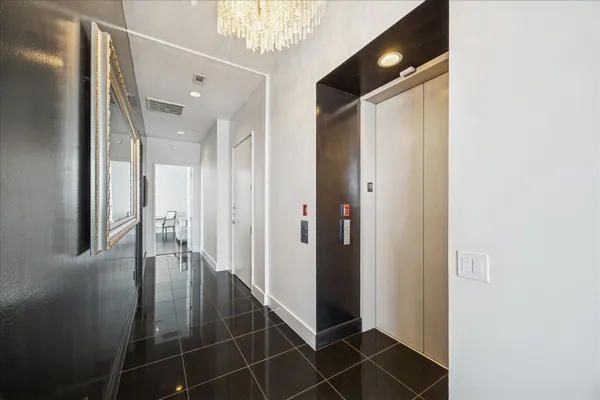 a bathroom with a shower and a mirror