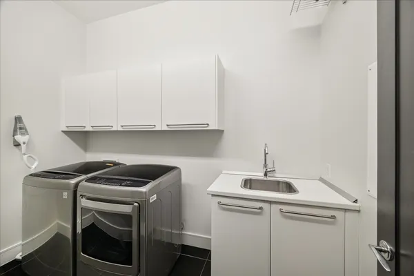 a view of storage and utility room with washer and dryer