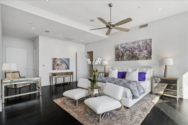 a living room with furniture a rug and a table