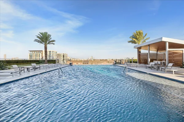 a view of a swimming pool with a lounge chair