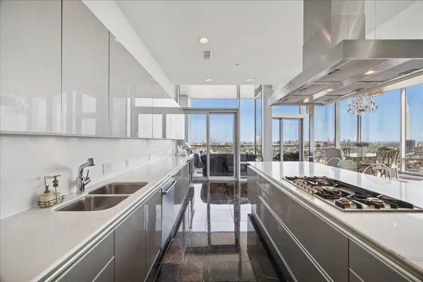 a kitchen with stove and cabinets