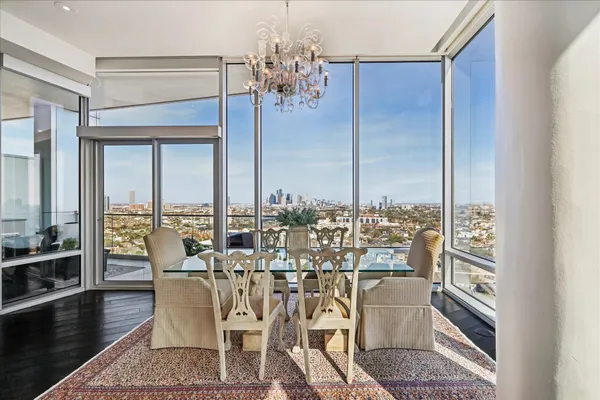 a view of a dining room with furniture window and wooden floor