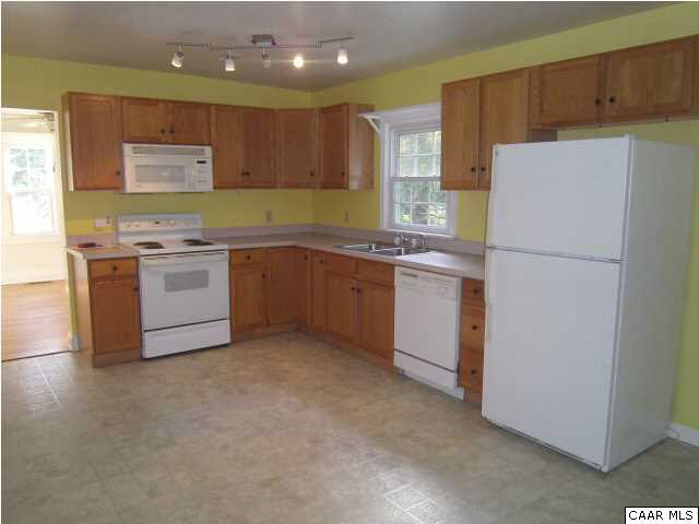 4215 Oak Hill Road Buckingham, VA 23921 - Photo 5 of 9 a kitchen with a stove a refrigerator and a sink
