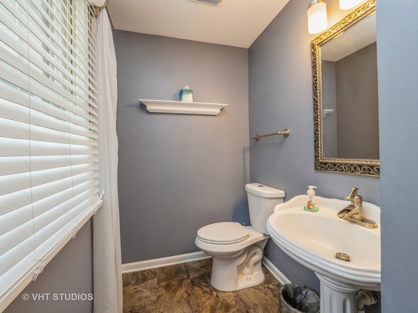 411 Ashfork Trail Cary, IL 60013 - Photo 11 of 25 a white toilet sitting next to a bathroom sink