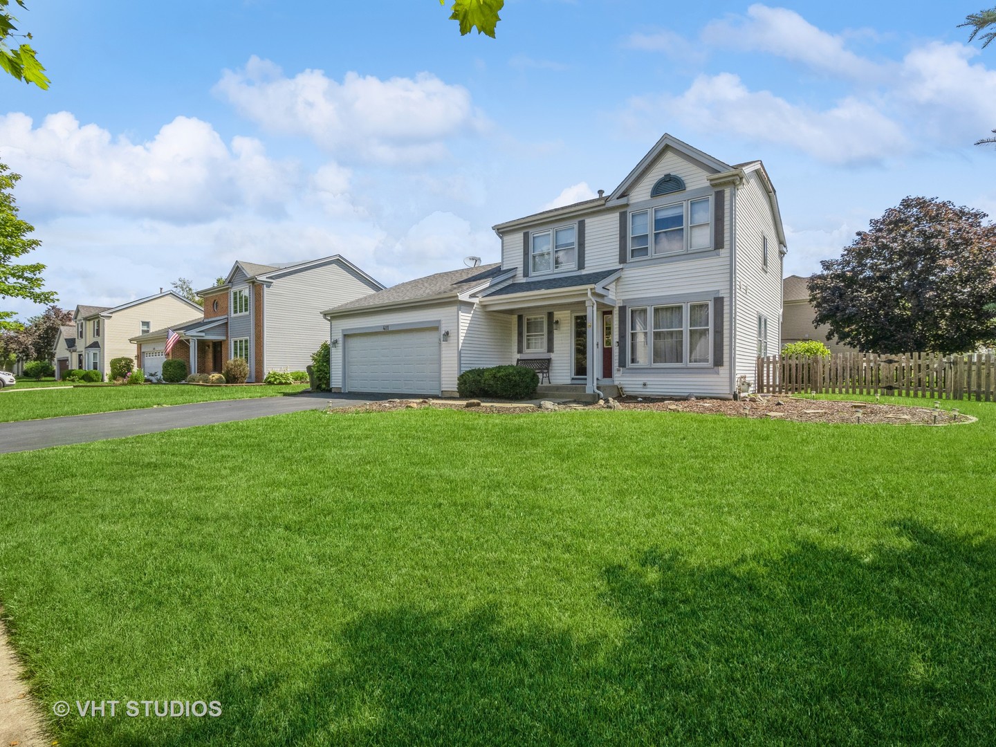 411 Ashfork Trail Cary, IL 60013 - Photo 12 of 25 a view of a house with a big yard and large trees