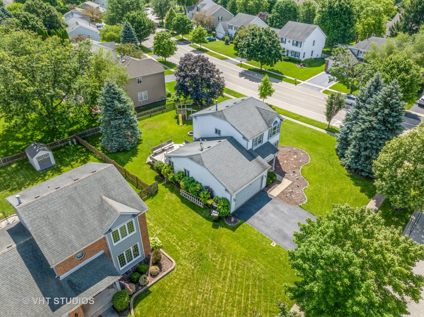 411 Ashfork Trail Cary, IL 60013 - Photo 14 of 25 an aerial view of a house with a swimming pool