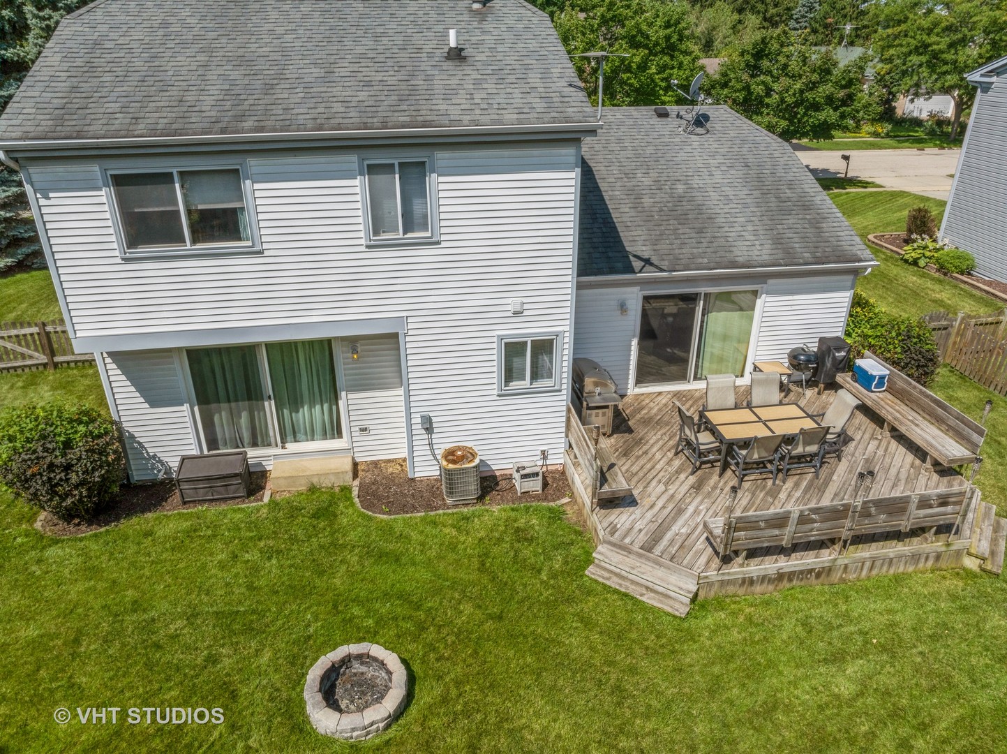 411 Ashfork Trail Cary, IL 60013 - Photo 18 of 25 a backyard of a house with table and chairs