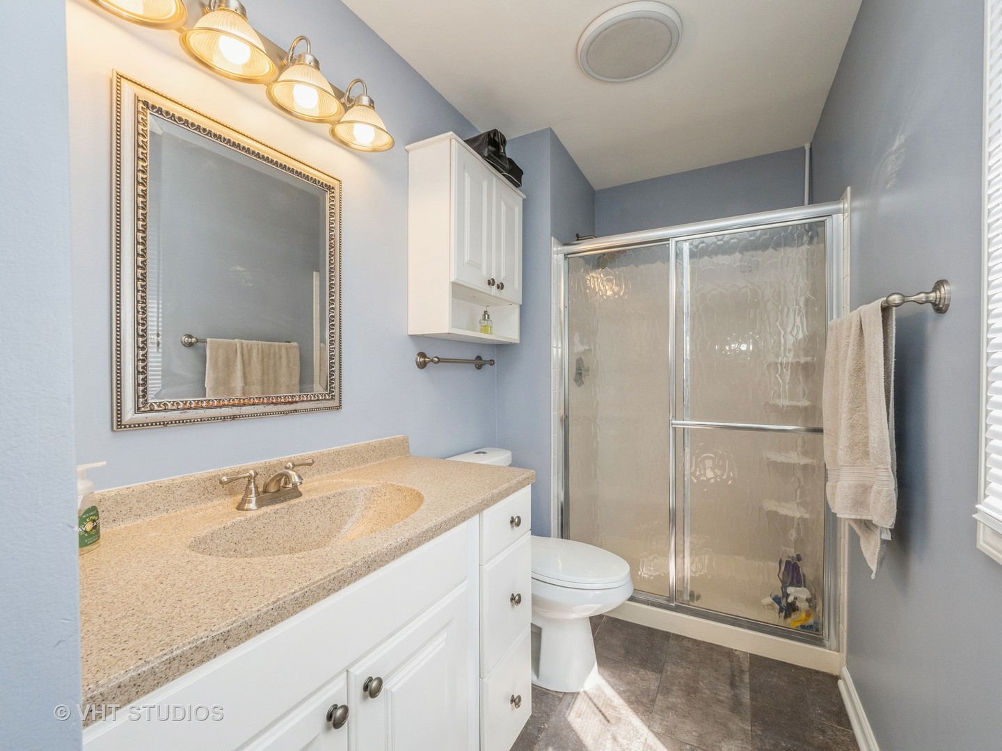 411 Ashfork Trail Cary, IL 60013 - Photo 7 of 25 a bathroom with a sink toilet and shower