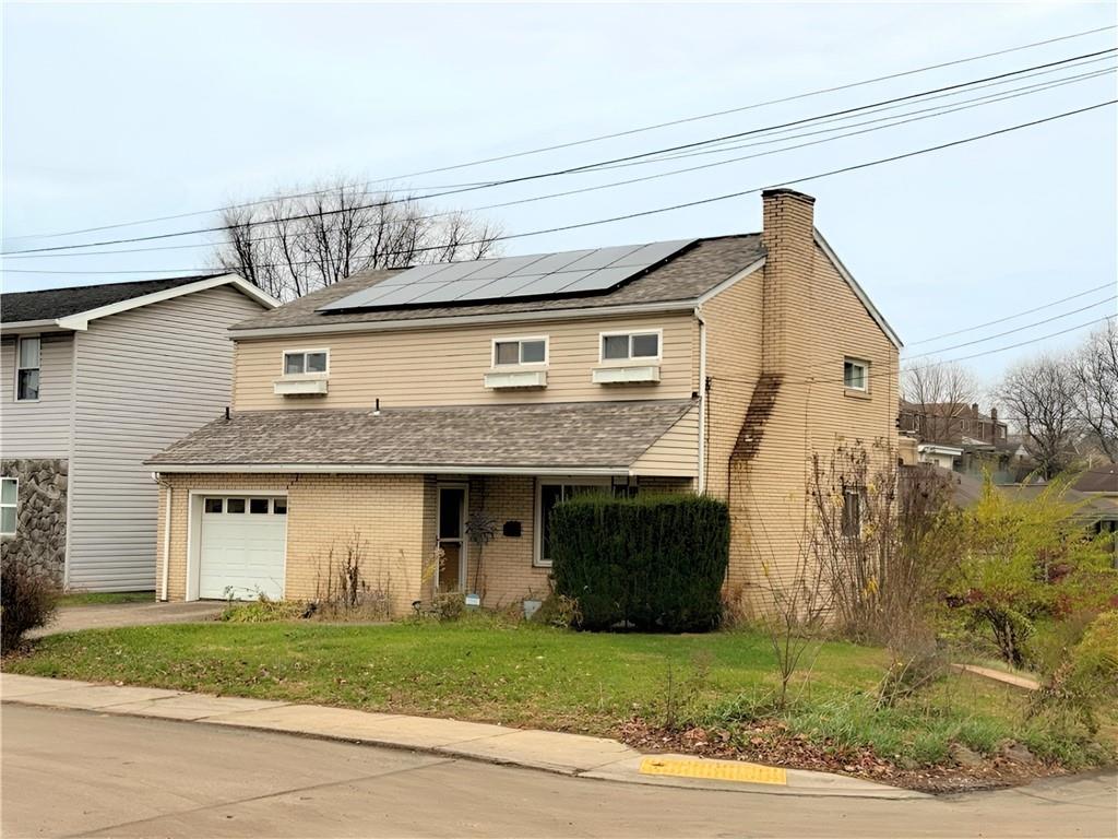 50 Philander Street Pittsburgh, PA 15218 - Photo 1 of 44 a front view of a house with a yard and garage