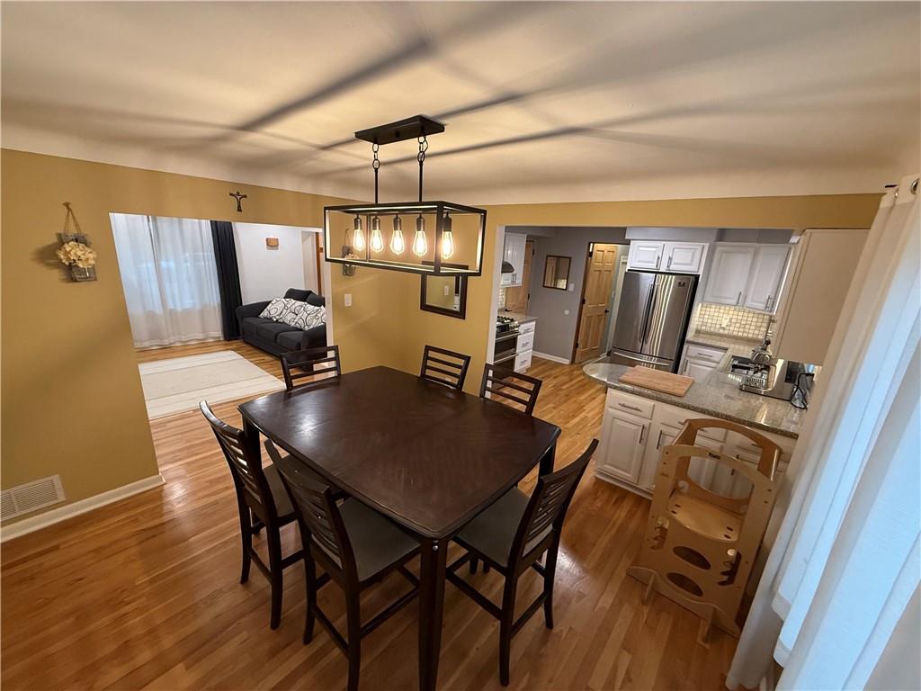 50 Philander Street Pittsburgh, PA 15218 - Photo 14 of 44 a view of a dining room with furniture and chandelier