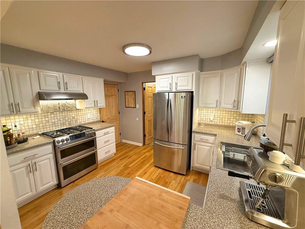 50 Philander Street Pittsburgh, PA 15218 - Photo 16 of 44 a kitchen with granite countertop a refrigerator stove and sink
