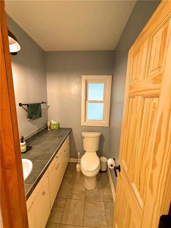 50 Philander Street Pittsburgh, PA 15218 - Photo 19 of 44 a bathroom with a granite countertop sink and a mirror