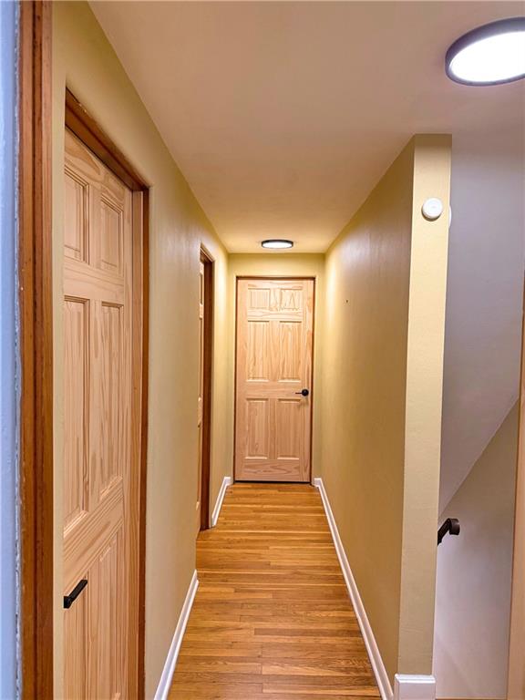 50 Philander Street Pittsburgh, PA 15218 - Photo 23 of 44 a view of a hallway with wooden floor and staircase