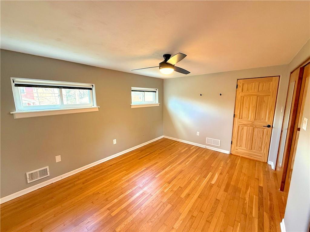 50 Philander Street Pittsburgh, PA 15218 - Photo 27 of 44 a view of empty room with wooden floor and fan