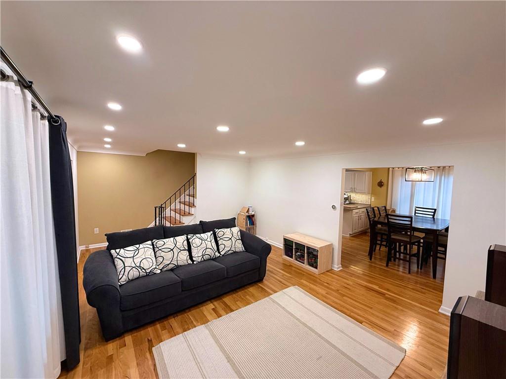 50 Philander Street Pittsburgh, PA 15218 - Photo 10 of 44 a living room with furniture and a dining table with kitchen view
