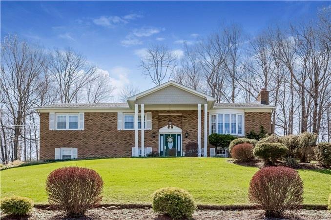 229 Tanglewood Road Trumbull, CT 06611 - Photo 1 of 1 a front view of a house with garden