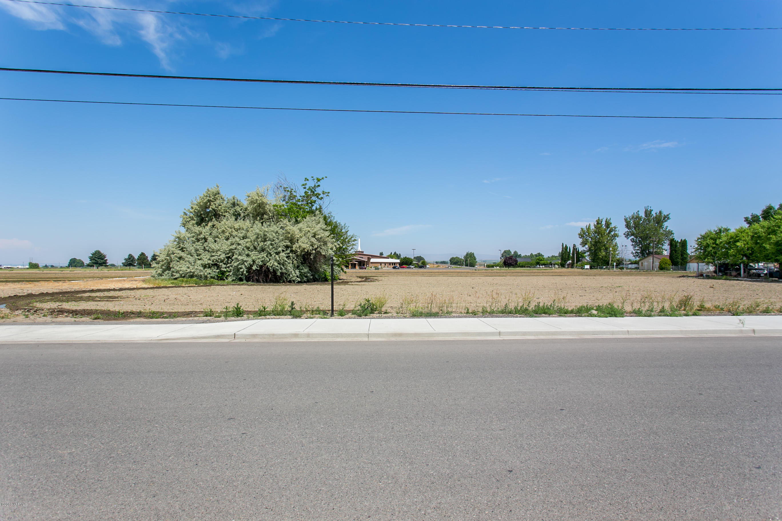 Tbd Bonnieview Road East Grandview, WA 98930 - Photo 1 of 6 a view of a road and a building in the background