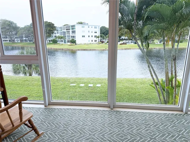 a view of a room with furniture and a window