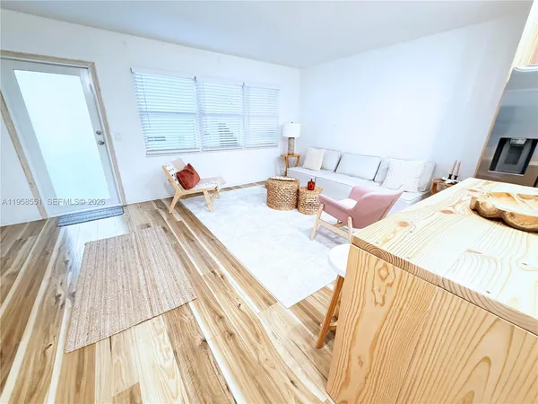 a bed sitting in a bedroom and chair