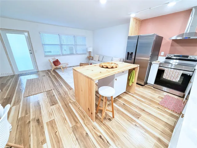 a view of kitchen and wooden floor
